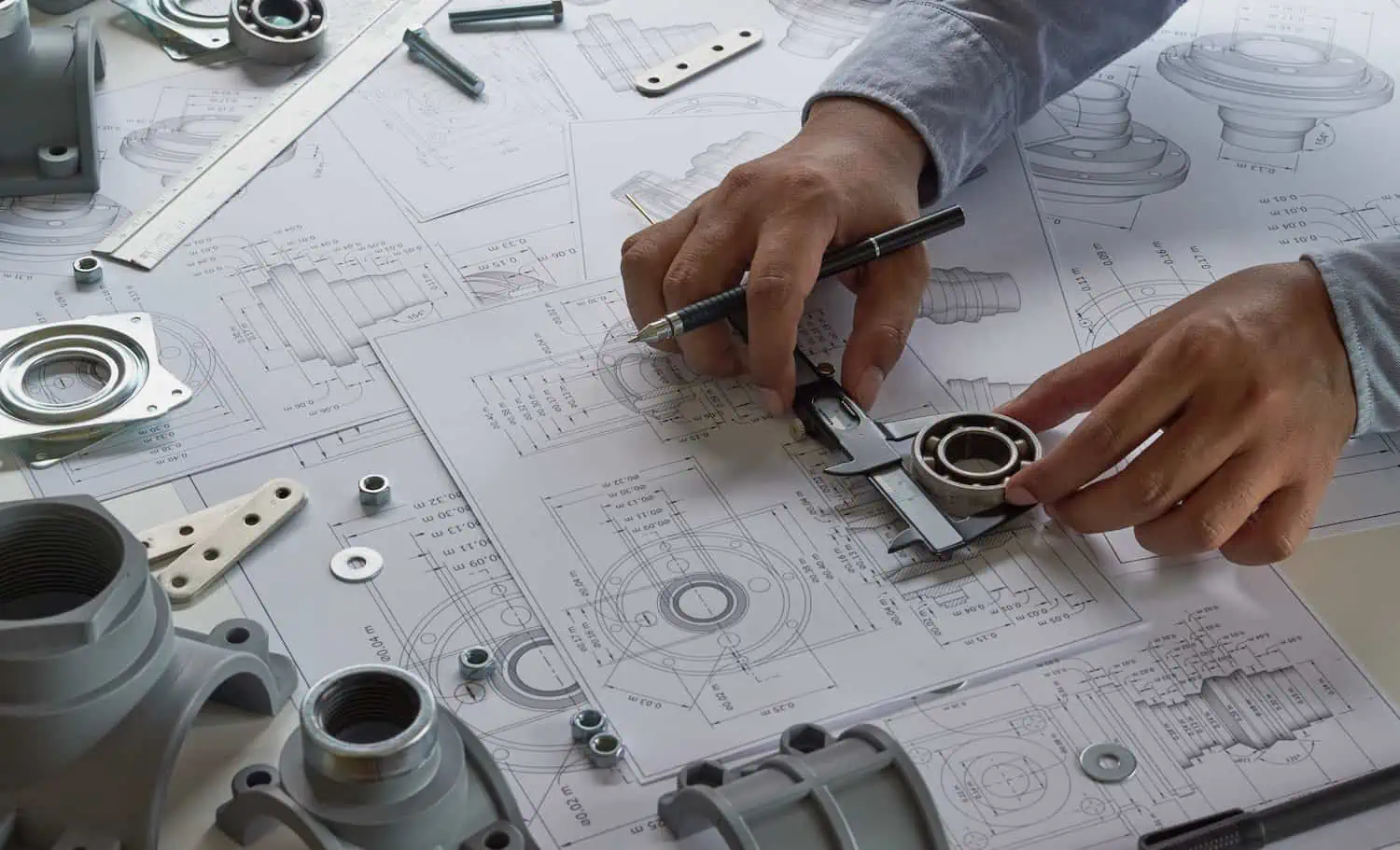 Engineer technician designing drawings mechanical parts